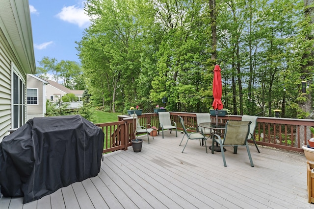 403 Mulligan Dr Unit 403, Oxford, CT 06478 - deck featuring outdoor dining space, a grill, and view of scattered trees