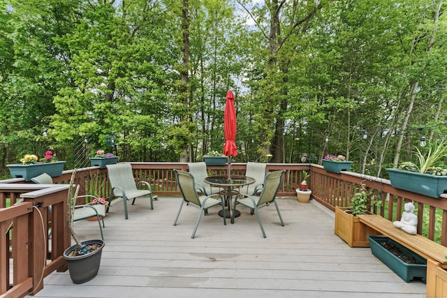 403 Mulligan Dr Unit 403, Oxford, CT 06478 - wooden terrace with outdoor dining area and view of wooded area