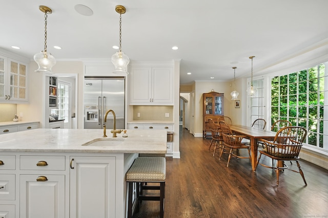 276 Greenley Rd, New Canaan, CT 06840 - kitchen with a sink, stainless steel built in fridge, glass insert cabinets, dark wood-style flooring, and white cabinets
