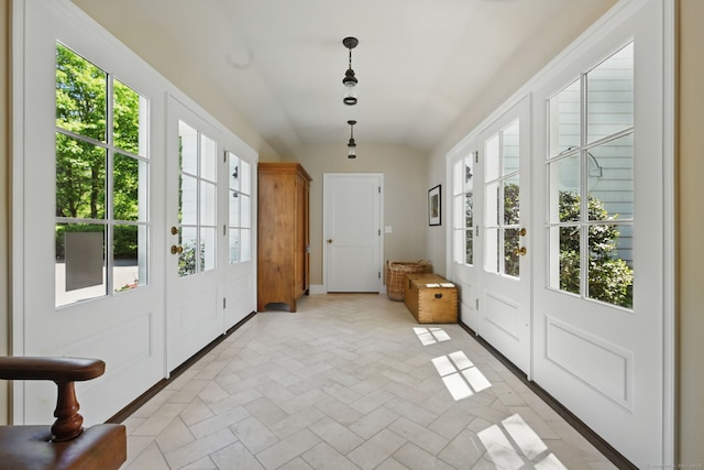 276 Greenley Rd, New Canaan, CT 06840 - doorway to outside featuring healthy amount of natural light, vaulted ceiling, baseboards, and brick patterned flooring