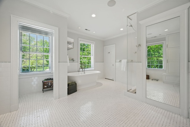 276 Greenley Rd, New Canaan, CT 06840 - full bathroom featuring a stall shower, a freestanding tub, a wainscoted wall, ornamental molding, and tile walls