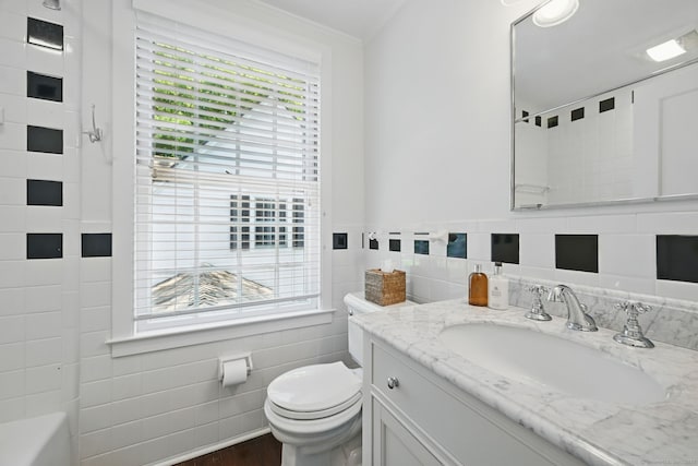 276 Greenley Rd, New Canaan, CT 06840 - full bathroom featuring tile walls, toilet, vanity, plenty of natural light, and ornamental molding