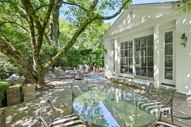 276 Greenley Rd, New Canaan, CT 06840 - view of patio / terrace featuring outdoor dining area and a fire pit