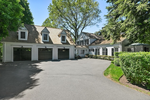 276 Greenley Rd, New Canaan, CT 06840 - view of front of home featuring a garage and driveway