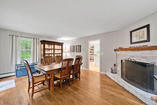 6 Cedar Cir, Newtown, CT 06470 - dining space featuring light wood-style flooring and a brick fireplace
