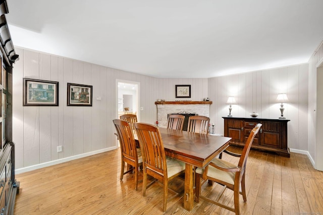 6 Cedar Cir, Newtown, CT 06470 - dining room with light wood finished floors, baseboards, and a fireplace