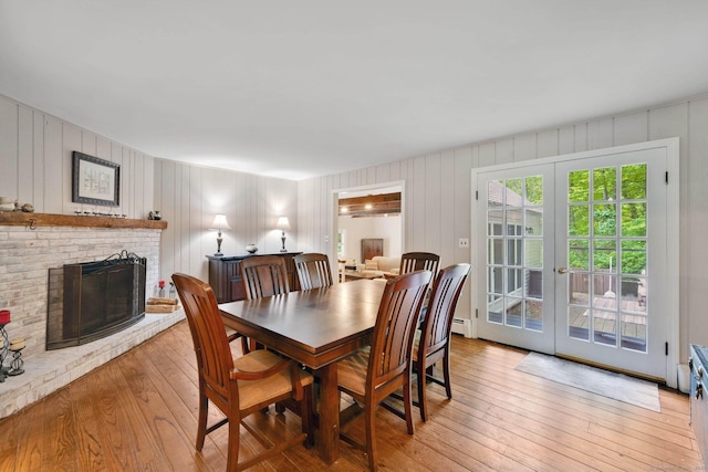 6 Cedar Cir, Newtown, CT 06470 - dining space featuring light wood-style flooring, french doors, a fireplace, and baseboard heating