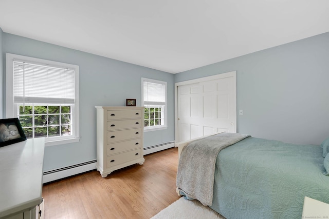 6 Cedar Cir, Newtown, CT 06470 - bedroom with multiple windows, baseboard heating, and wood finished floors