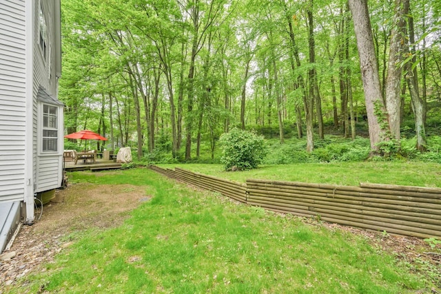 6 Cedar Cir, Newtown, CT 06470 - view of grassy yard featuring a wooden deck and a wooded view