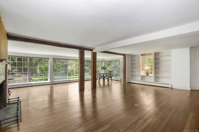 708 Ponus Rdg, New Canaan, CT 06840 - unfurnished living room with a fireplace with raised hearth, baseboard heating, wood finished floors, beam ceiling, and built in features