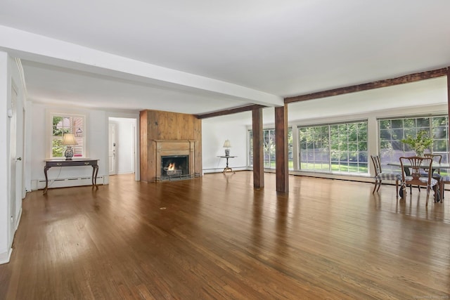708 Ponus Rdg, New Canaan, CT 06840 - unfurnished living room with a baseboard heating unit, wood finished floors, and a large fireplace