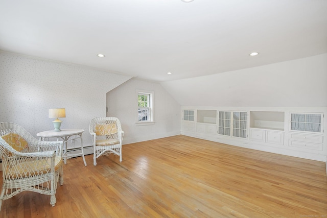 708 Ponus Rdg, New Canaan, CT 06840 - sitting room with wood finished floors, a baseboard radiator, lofted ceiling, recessed lighting, and baseboards