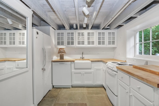 708 Ponus Rdg, New Canaan, CT 06840 - kitchen with butcher block countertops, white appliances, a sink, and white cabinetry