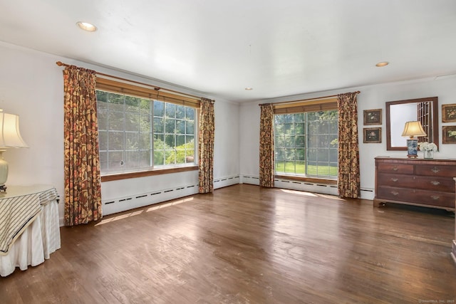 708 Ponus Rdg, New Canaan, CT 06840 - empty room with wood finished floors, crown molding, a baseboard heating unit, and recessed lighting