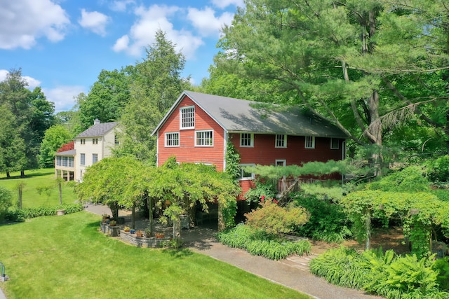 708 Ponus Rdg, New Canaan, CT 06840 - view of property exterior with a yard and view of wooded area