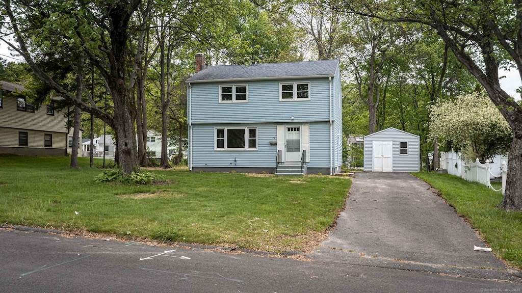 79 Arrowbrook Rd, Windsor, CT 06095 - colonial inspired home featuring entry steps, a chimney, a front lawn, and asphalt driveway