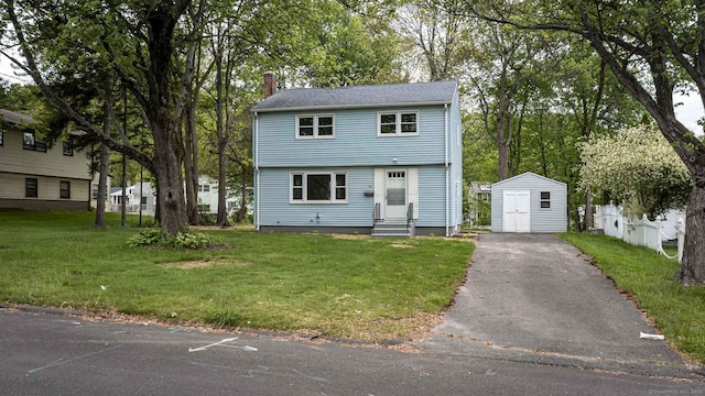 79 Arrowbrook Rd, Windsor, CT 06095 - colonial inspired home featuring entry steps, a chimney, a front lawn, and asphalt driveway