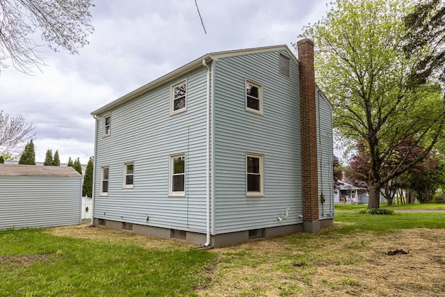 79 Arrowbrook Rd, Windsor, CT 06095 - view of property exterior with a chimney and a yard