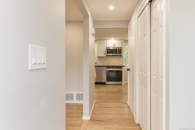 79 Arrowbrook Rd, Windsor, CT 06095 - hall with light wood-style flooring, crown molding, recessed lighting, and baseboards