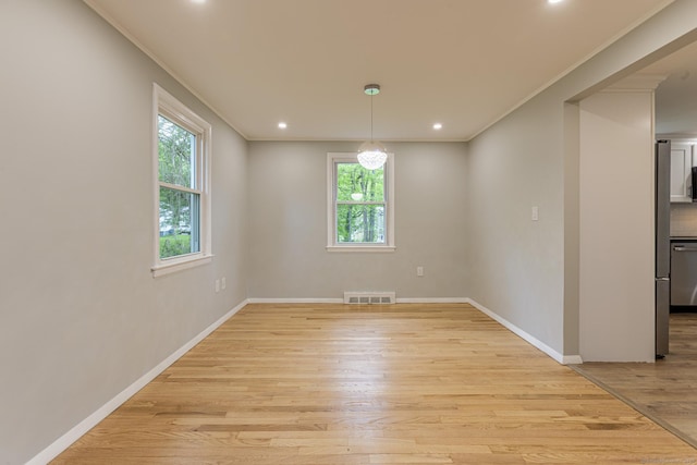 79 Arrowbrook Rd, Windsor, CT 06095 - unfurnished room featuring healthy amount of natural light, crown molding, light wood-style floors, recessed lighting, and baseboards