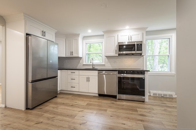 79 Arrowbrook Rd, Windsor, CT 06095 - kitchen featuring stainless steel appliances, a sink, healthy amount of natural light, light wood-style flooring, and recessed lighting