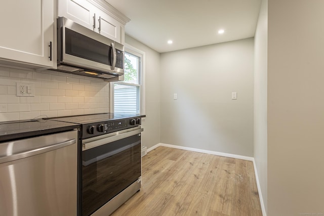 79 Arrowbrook Rd, Windsor, CT 06095 - kitchen featuring appliances with stainless steel finishes, tasteful backsplash, light wood-style floors, white cabinets, and recessed lighting
