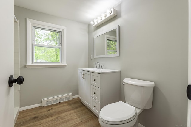 79 Arrowbrook Rd, Windsor, CT 06095 - bathroom with wood finished floors, toilet, vanity, and baseboards