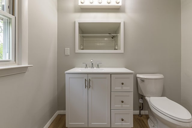 79 Arrowbrook Rd, Windsor, CT 06095 - full bathroom featuring baseboards, wood finished floors, toilet, and vanity