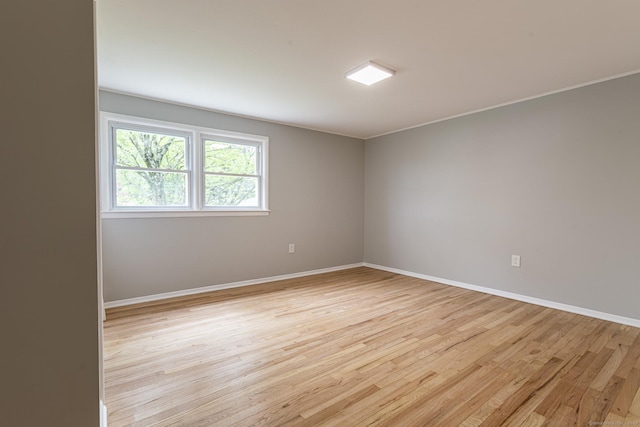 79 Arrowbrook Rd, Windsor, CT 06095 - empty room with light wood-style floors, baseboards, and ornamental molding