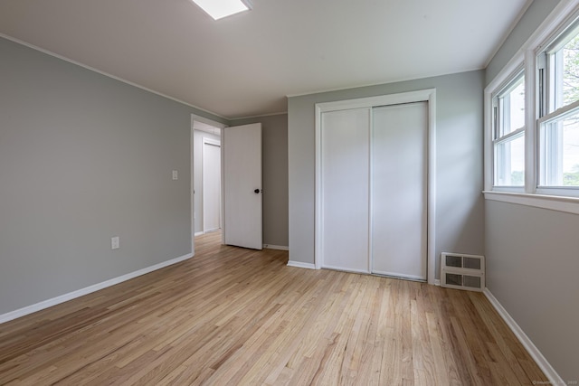 79 Arrowbrook Rd, Windsor, CT 06095 - unfurnished bedroom with light wood-style floors, baseboards, a closet, and ornamental molding