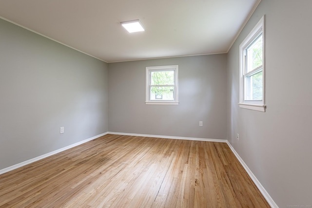 79 Arrowbrook Rd, Windsor, CT 06095 - spare room with light wood-style flooring, baseboards, and crown molding
