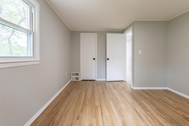 79 Arrowbrook Rd, Windsor, CT 06095 - unfurnished bedroom featuring light wood-type flooring, baseboards, multiple windows, and crown molding