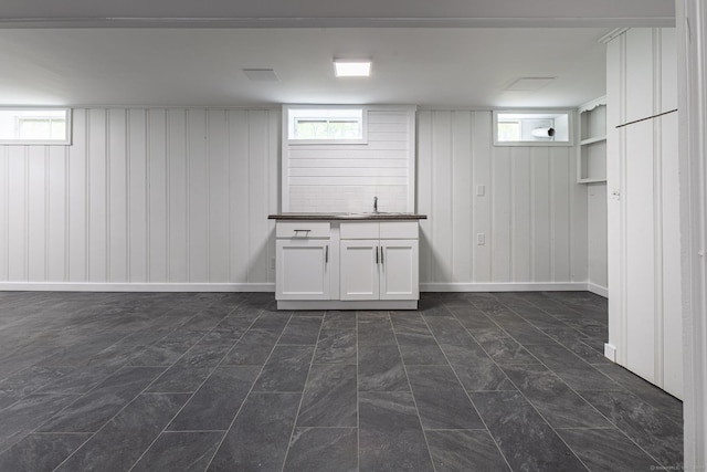 79 Arrowbrook Rd, Windsor, CT 06095 - basement featuring wood walls, a sink, and plenty of natural light