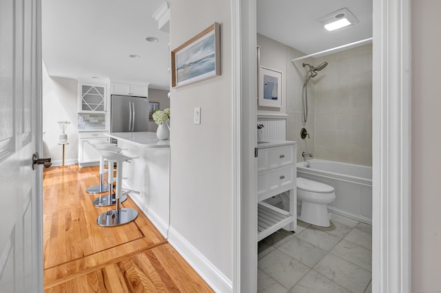 5 Wildmere Ln, Norwalk, CT 06851 - bathroom featuring shower / tub combination, toilet, and marble finish flooring