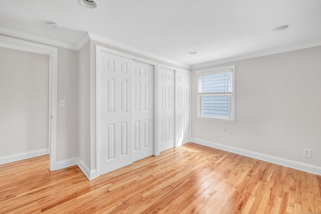 5 Wildmere Ln, Norwalk, CT 06851 - unfurnished bedroom with multiple closets, ornamental molding, light wood-style floors, and baseboards