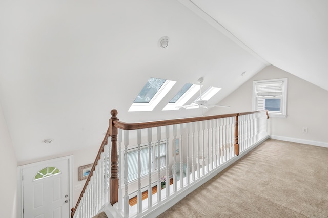 5 Wildmere Ln, Norwalk, CT 06851 - corridor with vaulted ceiling, a skylight, carpet floors, and baseboards