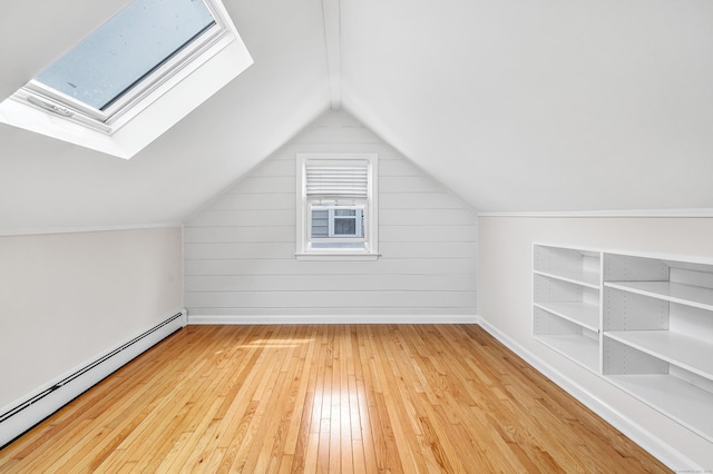 5 Wildmere Ln, Norwalk, CT 06851 - bonus room with a baseboard heating unit, hardwood / wood-style floors, a skylight, vaulted ceiling, and baseboards