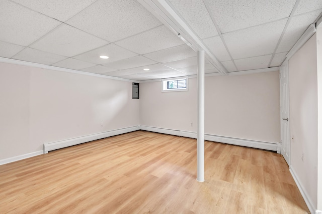 5 Wildmere Ln, Norwalk, CT 06851 - basement with a paneled ceiling, wood finished floors, a baseboard heating unit, recessed lighting, and baseboards