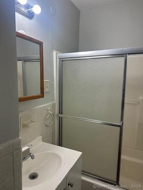 40 Orchard St, Bristol, CT 06010 - full bathroom with vanity and tile walls