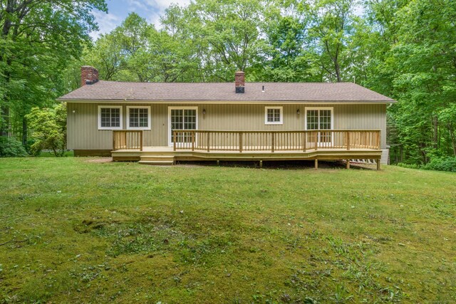 4 Leopard Dr, Newtown, CT 06482 - rear view of house with a chimney, a lawn, and a wooden deck