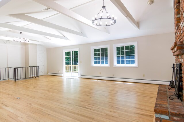 4 Leopard Dr, Newtown, CT 06482 - unfurnished living room with a chandelier, a baseboard heating unit, and wood finished floors