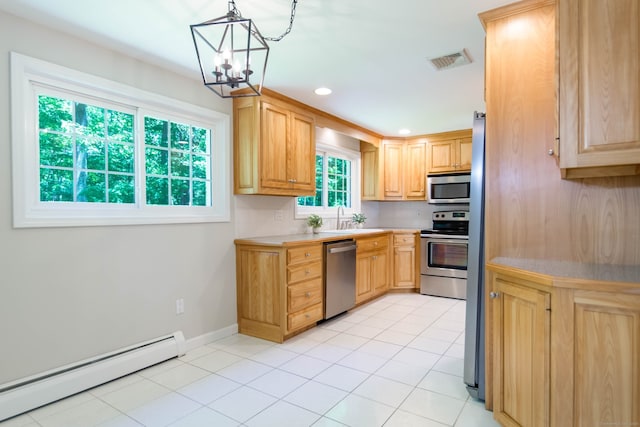 4 Leopard Dr, Newtown, CT 06482 - kitchen featuring appliances with stainless steel finishes, baseboard heating, light countertops, a chandelier, and a sink