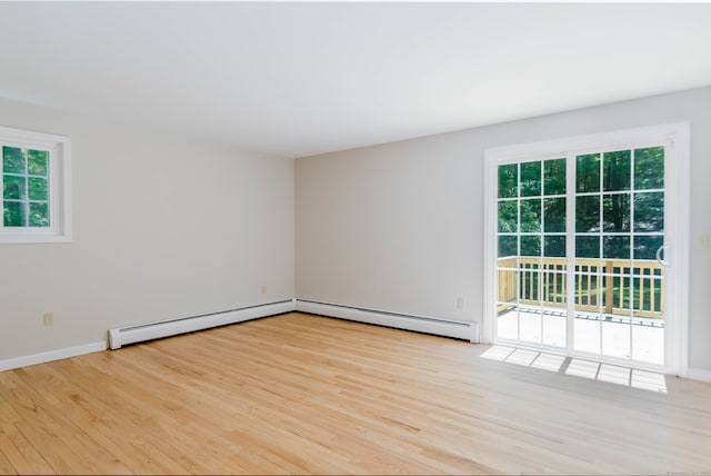 4 Leopard Dr, Newtown, CT 06482 - empty room with a baseboard radiator, wood finished floors, and healthy amount of natural light