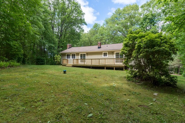 4 Leopard Dr, Newtown, CT 06482 - rear view of property featuring a chimney, a wooden deck, and a yard