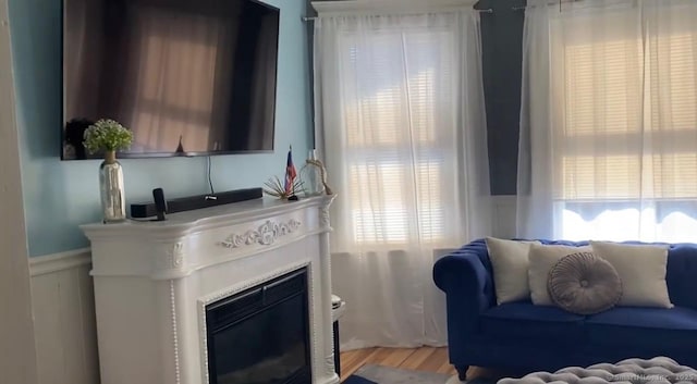 392 Laurel Ave, Bridgeport, CT 06605 - living area with a fireplace with flush hearth and light wood-style flooring