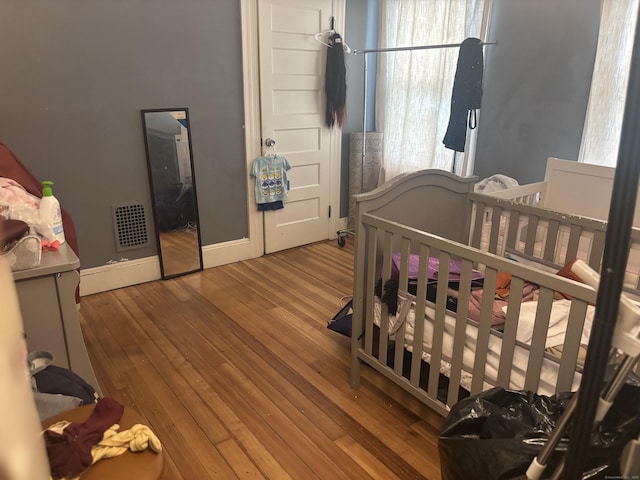 392 Laurel Ave, Bridgeport, CT 06605 - bedroom featuring wood-type flooring and baseboards