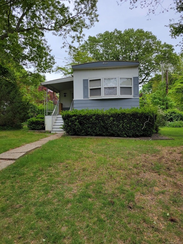 932 Long Cove Rd Trlr 8, Ledyard, CT 06335 - manufactured / mobile home featuring a front lawn and covered porch