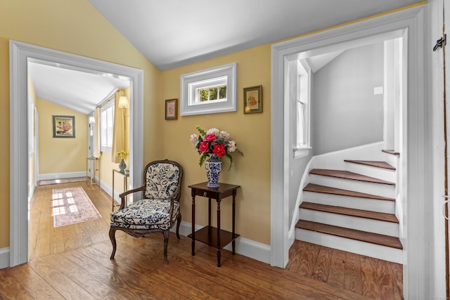 94 Glen Rd, Newtown, CT 06482 - hallway featuring vaulted ceiling, hardwood / wood-style floors, stairway, and baseboards