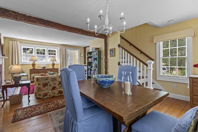 94 Glen Rd, Newtown, CT 06482 - dining space with hardwood / wood-style flooring, a chandelier, healthy amount of natural light, and beamed ceiling