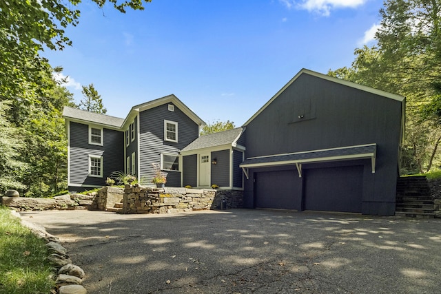 94 Glen Rd, Newtown, CT 06482 - view of front facade with asphalt driveway, roof with shingles, and stone siding